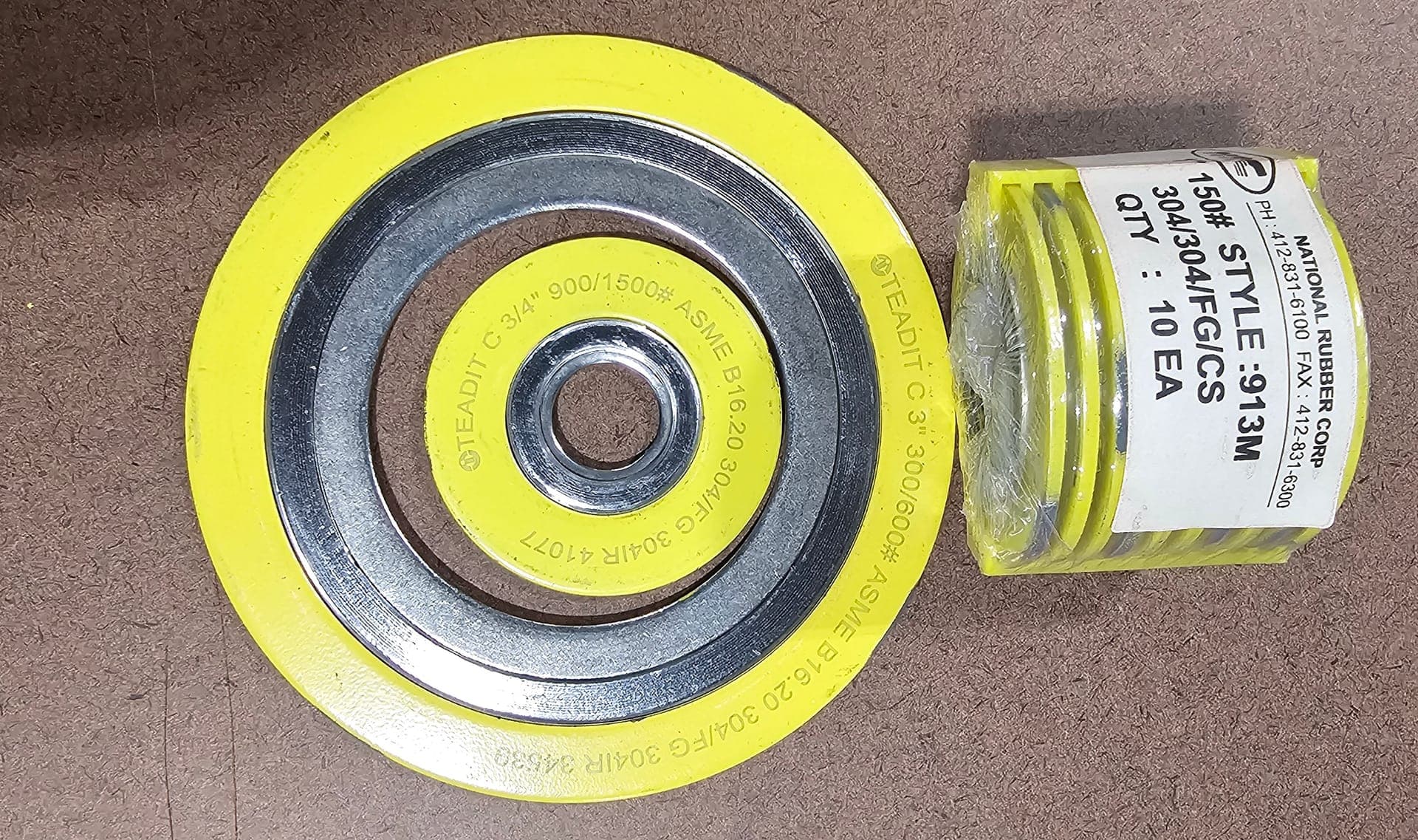 Spiral wound gasket next to a labeled pack of ten